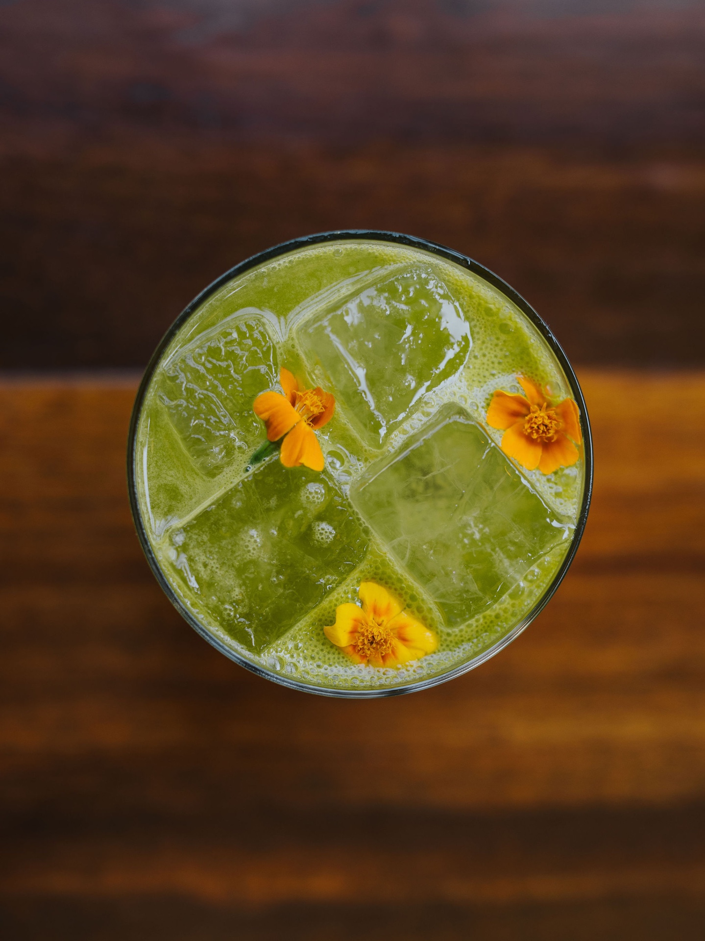 Garden-inspired house cocktail in a coupe glass