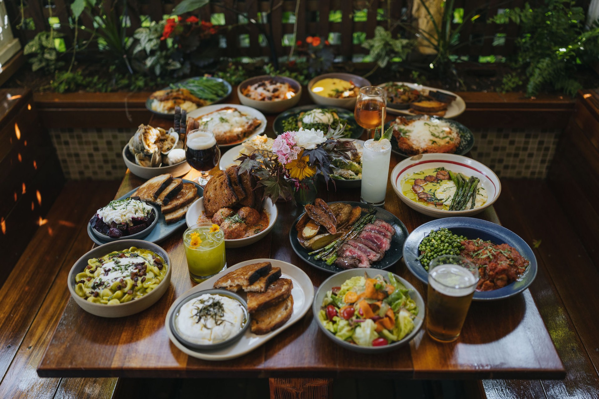The Nor'East — craft cocktails & kitchen patio at golden hour
